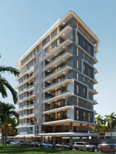 Side-angle architectural render of The Lavender Victoria Island luxury apartment tower with curved balconies, glass facade, palm trees, and street-level parking